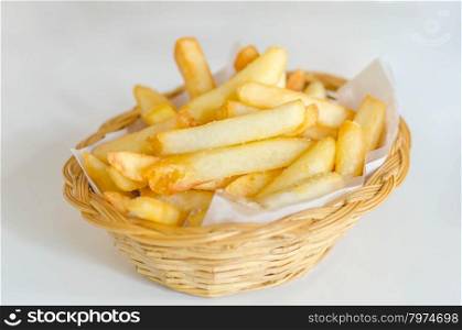 French fries . Traditional French fries in a bamboo basket