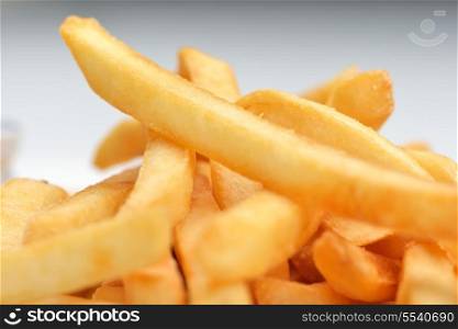 French fries with ketchup over white background
