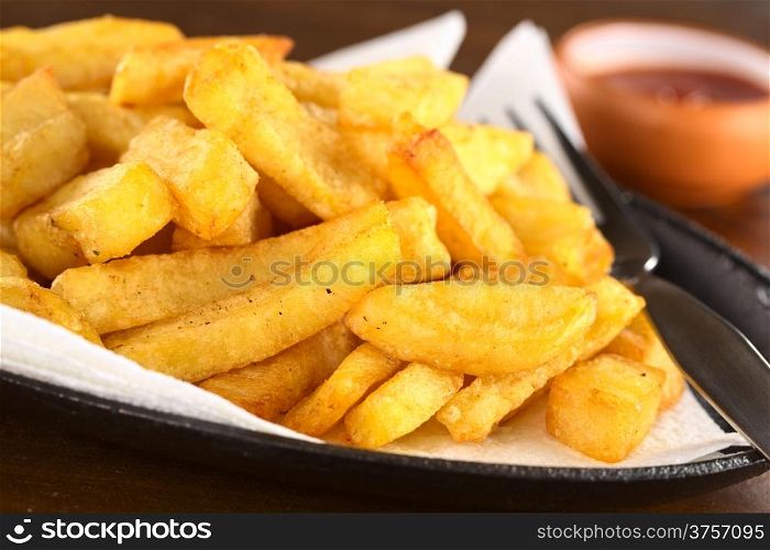 French fries with ketchup (Selective Focus, Focus one third into the fries)