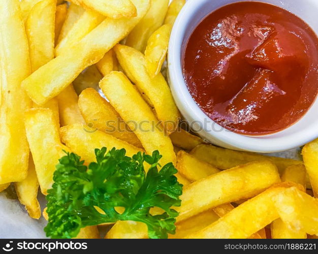 French fries with tomato sauce and parsley