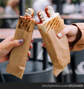 French hot dogs in woman`s hand
