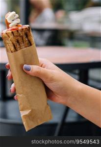 French hot dogs in woman`s hand