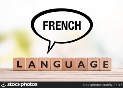 French language lesson sign made of cubes on a table