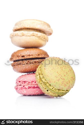 French luxury colorful macarons dessert cakes on white background with sugar on top