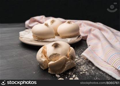 French meringue cookies on slate background