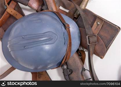 french military helmet of the First World War with rifle isolated on white background
