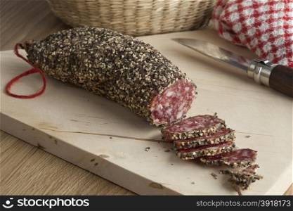 French sausage covered with black and white pepper