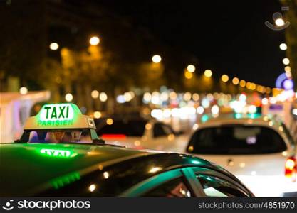 French taxi with the champs elysees avenue in background