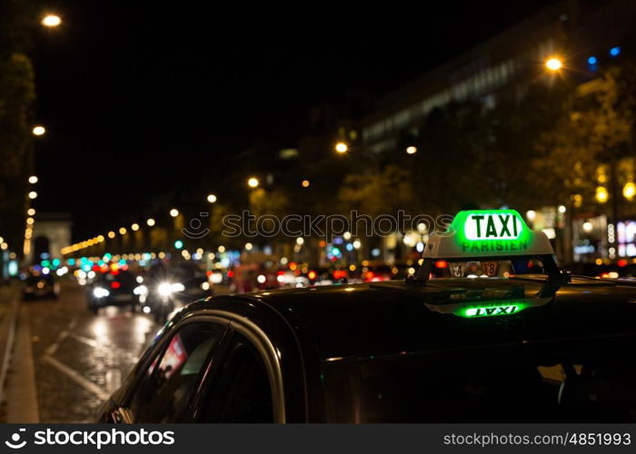 French taxi with the champs elysees avenue in background