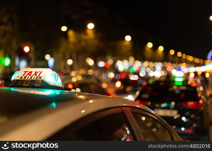 French taxi with the champs elysees avenue in background