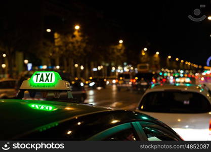 French taxi with the champs elysees avenue in background