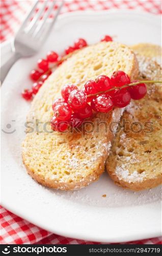 french toast with redcurrant and powder sugar for breakfast