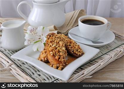 French toast with walnuts and cinnamon and a cup of coffee