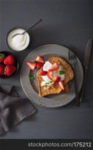 french toasts with yogurt and strawberries for breakfast