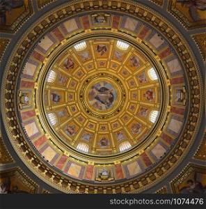 Fresco painting on the dome of a catholic cathedral church with religious images in color of saints and scenes of the Bible in color