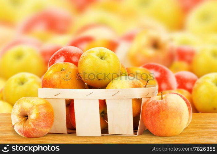 Fresh and colorful apples in basket, selective focus