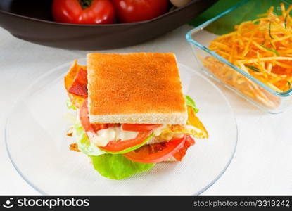 fresh and delicious classic club sandwich over a transparent glass dish