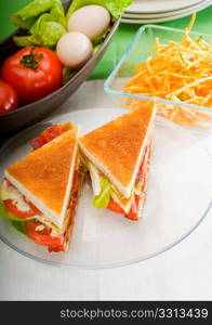 fresh and delicious classic club sandwich over a transparent glass dish