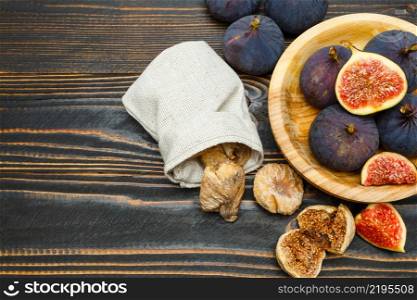 Fresh and dried Organic Fig isolated on wooden background. Fresh and dried Fig isolated on wooden background