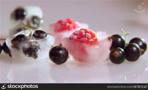 Fresh and frozen berries - raspberry, red and black currant dolly shot