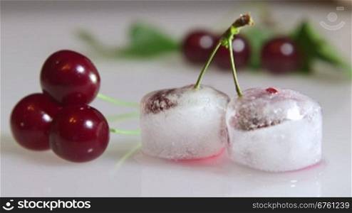 Fresh and frozen cherry fruit background closeup time-lapse