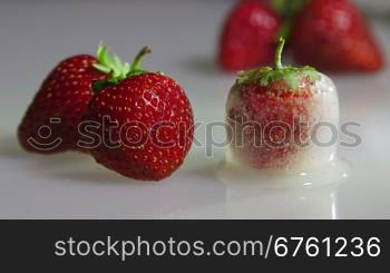 Fresh and frozen strawberry closeup time-lapse