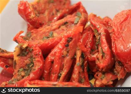Fresh and healthy appetizers: dried tomatoes with herbs