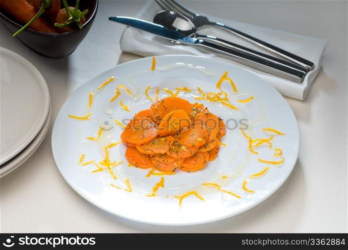 fresh and healthy Honey glazed carrots on a plate with tyme on top