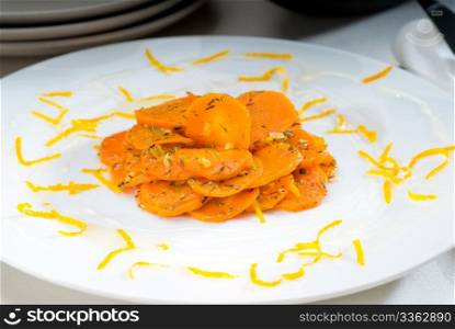 fresh and healthy Honey glazed carrots on a plate with tyme on top