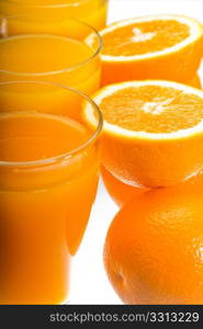 fresh and healthy orange juice ,unfiltered ,over a light table