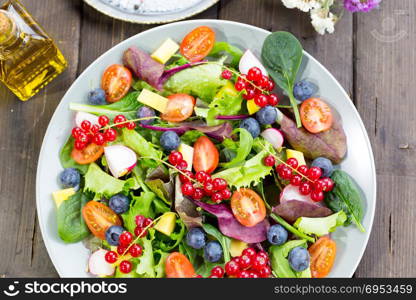 Fresh and healthy salad made with fruits and vegetables