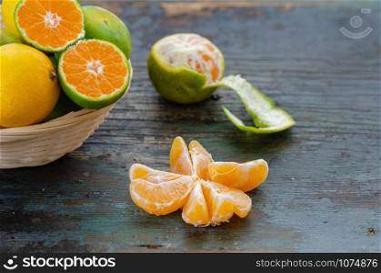 Fresh and juicy mandarin fruit on the wooden table.