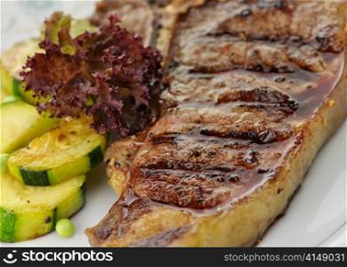 fresh and juicy t-bone steak with vegetables