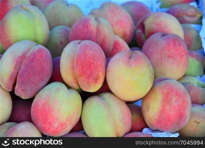 Fresh and ripe peaches are sold at the Bazaar