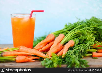 fresh and sweet carrot slices for cooking food fruits and vegetables for health concept, fresh carrots juice on glass with ice on summer, carrot juice on wooden table background