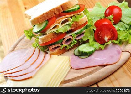 Fresh and tasty sandwich on wooden table