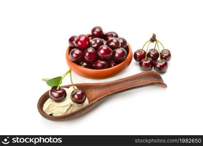 Fresh appetizing sweet cherries and fruit mousse isolated on white background.