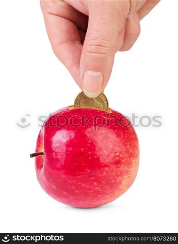 Fresh apple as piggy bank and hand with coin isolated.&#xA;Concept of healthy lifestyle investment .