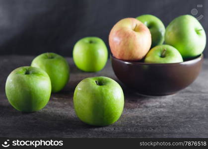 fresh apple. Bowl of green apples and apple over wooden board