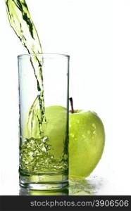 fresh apple juice in glass with green apple isolated on white