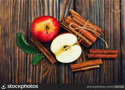 fresh apples with cinnamon on a table