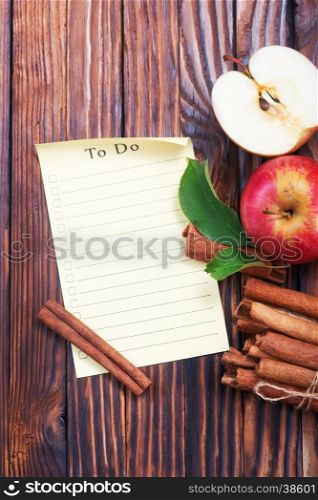 fresh apples with cinnamon on a table