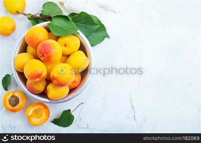 fresh apricots in bowl on a table