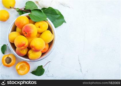 fresh apricots in bowl on a table