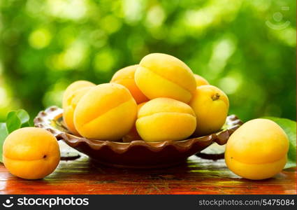 fresh apricots on wooden table