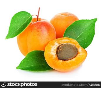 Fresh apricots with leaves close-up isolated on a white background.