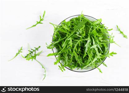 Fresh arugula or rocket leaves salad, rucola, top view