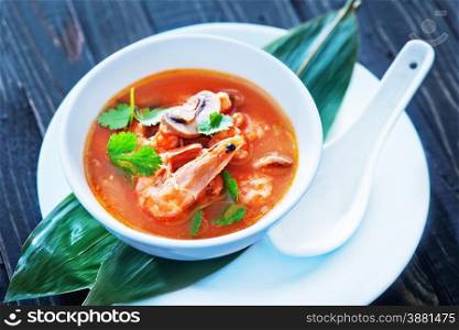 fresh asian soup in bowl and on a table