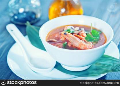 fresh asian soup in bowl and on a table