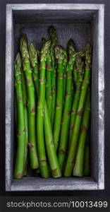 Fresh asparagus in a whitewashed rustic wooden box